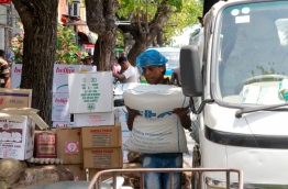 A person unloading goods to a shop at the local market. PHOTO: MOHAMED SHARUHAAN/MIHAARU