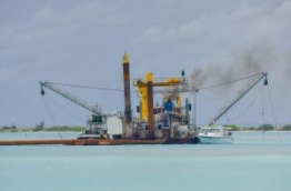 A dredger reclaims land for Maldives main airport's new runway. MIHAARU PHOTO/MOHAMED SHARUHAAN