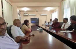 Election commission members meeting top MDP officials.