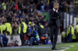 Manchester City's Spanish coach Pep Guardiola looks on during the UEFA Champions League football match FC Barcelona vs Manchester City at the Camp Nou stadium in Barcelona on October 19, 2016. / AFP PHOTO / JOSEP LAGO