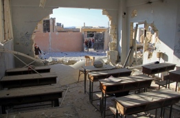 A general view shows a damaged classroom at a school after it was hit in an air strike in the village of Hass, in the south of Syria's rebel-held Idlib province on October 26, 2016. / AFP PHOTO / Omar haj kadour
