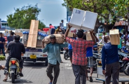 Unloading goods at the local market in capital Male. FILE PHOTO: NISHAN ALI/MIHAARU
