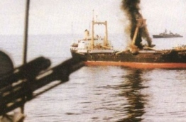 MV Progress Light, commandeered by Sri Lankan mercenaries during the coup on November 3, 1988, smokes after the attack by Indian frigate INS Godavari.