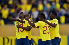 Players of Ecuador celebrate after scoring against Venezuela during their 2018 FIFA World Cup qualifier football match in Quito, on November 15, 2016. / AFP PHOTO / RODRIGO BUENDIA