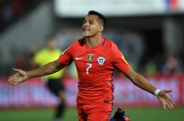 Chile's forward Alexis Sanchez celebrates after scoring against Uruguay during their 2018 FIFA World Cup qualifier football match in Santiago, on November 15, 2016. / AFP PHOTO / Martin BERNETTI