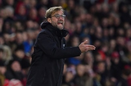 Liverpool's German manager Jurgen Klopp reacts during the English Premier League football match between Southampton and Liverpool at St Mary's Stadium in Southampton, southern England on November 19, 2016. / AFP PHOTO / BEN STANSALL / RESTRICTED TO EDITORIAL USE. No use with unauthorized audio, video, data, fixture lists, club/league logos or 'live' services. Online in-match use limited to 75 images, no video emulation. No use in betting, games or single club/league/player publications. /