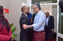 AFC President Sheikh Salman (R) &amp; Maldives Olympic Committee president and AFC Executive Committee's Mohamed Shaveed greet each other. PHOTO: NISHAN ALI/MIHAARU