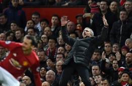 Manchester United's Portuguese manager Jose Mourinho gestures on the touchline during the English Premier League football match between Manchester United and Tottenham Hotspur at Old Trafford in Manchester, north west England, on December 11, 2016. / AFP PHOTO / OLI SCARFF / RESTRICTED TO EDITORIAL USE. No use with unauthorized audio, video, data, fixture lists, club/league logos or 'live' services. Online in-match use limited to 75 images, no video emulation. No use in betting, games or single club/league/player publications. /