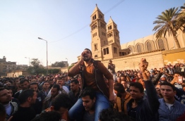 The blast killed at least 25 worshippers during Sunday mass inside the Cairo church near the seat of the Coptic pope who heads Egypt's Christian minority, state media said. / AFP PHOTO / MOHAMED METEAB