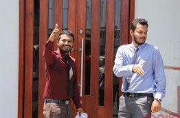 Raajje TV journalists Mohamed Visam (L) and Leevan Ali Nazeer outside the Criminal Court.
