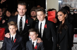 David Beckham (L), Victoria Beckham (R) and their sons pose for picture. PHOTO/AFP