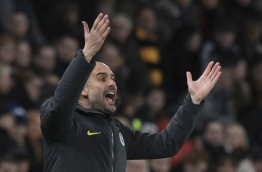Manchester City's Spanish manager Pep Guardiola gestures from the touchline during the English Premier League football match between Hull City and Manchester City at the KCOM Stadium in Kingston upon Hull, north east England on December 26, 2016. / AFP PHOTO / Lindsey PARNABY / RESTRICTED TO EDITORIAL USE. No use with unauthorized audio, video, data, fixture lists, club/league logos or 'live' services. Online in-match use limited to 75 images, no video emulation. No use in betting, games or single club/league/player publications. /