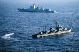 Chinese naval frigates conducting training programs in the South China Sea. PHOTO/AFP