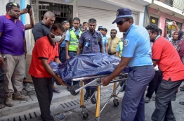 Police wheels out remains of couple discovered dead together in capital Male to be taken to IGMH. PHOTO: NISHAN ALI/MIHAARU