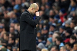 Manchester City's Spanish manager Pep Guardiola gestures on the touchline during the English Premier League football match between Manchester City and Tottenham Hotspur at the Etihad Stadium in Manchester, north west England, on January 21, 2017. / AFP PHOTO / Paul ELLIS / RESTRICTED TO EDITORIAL USE. No use with unauthorized audio, video, data, fixture lists, club/league logos or 'live' services. Online in-match use limited to 75 images, no video emulation. No use in betting, games or single club/league/player publications. /