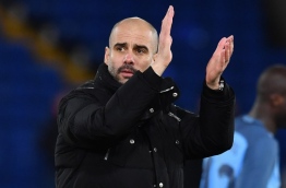Manchester City's Spanish manager Pep Guardiola applauds at the end of the English FA Cup fourth round football match between Crystal Palace and Manchester City at Selhurst Park in south London on January 28, 2017. / AFP PHOTO / Ben STANSALL / RESTRICTED TO EDITORIAL USE. No use with unauthorized audio, video, data, fixture lists, club/league logos or 'live' services. Online in-match use limited to 75 images, no video emulation. No use in betting, games or single club/league/player publications. /