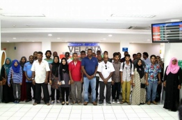 MPL CEO Mohamed Junaid pose with some people with special needs after they arrive at Velana International Airport to attend the ceremony awarding them jobs at MPL branches. PHOTO/MPL