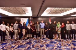 Education Minister Aishath Shiham and Australian Ambassador to the Maldives Bryce Hutchesson pose with students that received the Australia Awards scholarships in 2016. FILE PHOTO: NISHAN ALI/MIHAARU