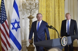 US President Donald Trump and Israel's Prime Minister Benjamin Netanyahu take arrive for a joint press conference in the East Room of the White House on February 15, 2017 in Washington, DC. / AFP PHOTO / MANDEL NGAN
