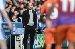 Manchester City's Spanish manager Pep Guardiola watches from the touchline during the English FA Cup fifth round football match between Huddersfield Town and Manchester City at the John Smith stadium in Huddersfield, northern England on February 18, 2017. / AFP PHOTO / OLI SCARFF / RESTRICTED TO EDITORIAL USE. No use with unauthorized audio, video, data, fixture lists, club/league logos or 'live' services. Online in-match use limited to 75 images, no video emulation. No use in betting, games or single club/league/player publications. /