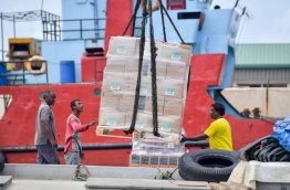 Goods being loaded into a boat at Male Commercial Harbour. PHOTO: NISHAN ALI/MIHAARU