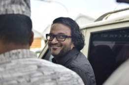 Former Vice President Adheeb escorted out of the Criminal Court. PHOTO: HUSSAIN WAHEED/MIHAARU