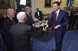 Comey considers Trump's accusation that former US President Barack Obama tapped his phones to be false, The New York Times reported March 5, 2017. Comey asked the Justice Department to correct Trump's unsubstantiated claim about his predecessor by publicly rejecting it, the Times said, citing senior US officials. The department has not done so. / AFP PHOTO / MANDEL NGAN