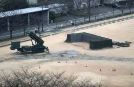 Japan's Prime Minister Shinzo Abe said three of the four missiles North Korea launched landed in Japanese-controlled waters, calling the development a "new stage of threat". / AFP PHOTO / Behrouz MEHRI