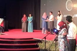 President Yameen handing over 'Rehendhi Award', given to women in appreciation of their work, at the celebration of International Women's Day 2017.  PHOTO/Social Media