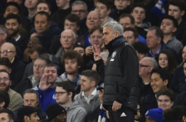 Manchester United's Portuguese manager Jose Mourinho gestures with three fingers on the touchline during the English FA Cup quarter final football match between Chelsea and Manchester United at Stamford Bridge in London on March 13, 2017. / AFP PHOTO / Glyn KIRK / RESTRICTED TO EDITORIAL USE. No use with unauthorized audio, video, data, fixture lists, club/league logos or 'live' services. Online in-match use limited to 75 images, no video emulation. No use in betting, games or single club/league/player publications. /