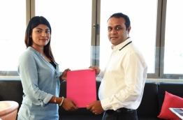MATATO Deputy Secretary General Asra Naseem (L) and Everything Red CEO Mohamed Rifau sign agreement tasking Everything Red to develop web platform to promote MATATO's activities and events. PHOTO/MATATO