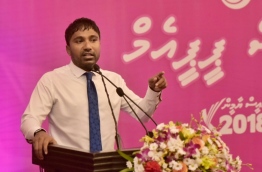 Dhangethi MP Ilham Ahmed speaks at PPM ceremony to present membership forms of ruling party's new members. PHOTO: HUSSAIN WAHEED/MIHAARU