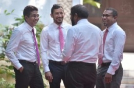 Lawmakers pictured outside the parliament ahead of a debate. PHOTO: HUSSAIN WAHEED/MIHAARU