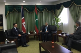 British Ambassador James Dauris (L) in a meeting with Minister of Foreign Affairs Mohamed Asim