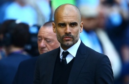 Manchester City's Spanish manager Pep Guardiola reacts ahead of the English Premier League football match between Manchester City and Hull City at the Etihad Stadium in Manchester, north west England, on April 8, 2017. / AFP PHOTO / GEOFF CADDICK / RESTRICTED TO EDITORIAL USE. No use with unauthorized audio, video, data, fixture lists, club/league logos or 'live' services. Online in-match use limited to 75 images, no video emulation. No use in betting, games or single club/league/player publications. /