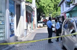 Police officers closed off the area around social media activist Yameen Rasheed's house after he was found murdered with multiple stab wounds. PHOTO: HUSSAIN WAHEED/MIHAARU