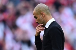 Manchester City's Spanish manager Pep Guardiola suffers defeat after the FA Cup semi-final football match between Arsenal and Manchester City at Wembley stadium in London on April 23, 2017. / AFP PHOTO / Glyn KIRK / NOT FOR MARKETING OR ADVERTISING USE / RESTRICTED TO EDITORIAL USE