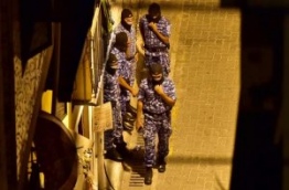 Police SO officers during raids on three places in Machangolhi ward in Male. PHOTO/MIHAARU