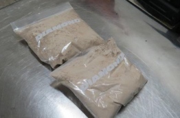Two packets of heroin weighing half a kilogram which a Maldivian tried to smuggle into the country. PHOTO:Customs
