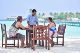 Two tourists being served at Sun Island Resort &amp; Spa. PHOTO: NISHAN ALI/MIHAARU