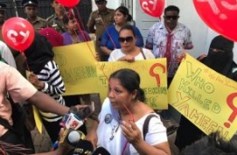 Sandhya Ekneligoda speaks to reporters at the protest against the murder of Yameen Rasheed held in front of the Maldivian Embassy in Colombo, Sri Lanka. PHOTO/SOCIAL MEDIA