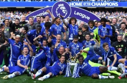 Chelsea's extended victory parade reached a climax with the trophy presentation on May 21, 2017 after being crowned Premier League champions with two games to go. / AFP PHOTO / Ben STANSALL / RESTRICTED TO EDITORIAL USE. No use with unauthorized audio, video, data, fixture lists, club/league logos or 'live' services. Online in-match use limited to 75 images, no video emulation. No use in betting, games or single club/league/player publications. /