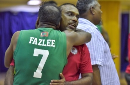 Ali Fazlee (L) embraces Supun Wimal, coach of the Maldives National Basketball Team after winning the SABA Championship match against Sri Lanka on May 23, 2017. PHOTO: NISHAN ALI/MIHAARU