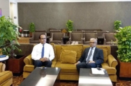 Foreign Minister Mohamed Asim (R) in a lounge at Velana International Airport prior to his departure to Sri Lanka. PHOTO/PRESIDENT'S OFFICE