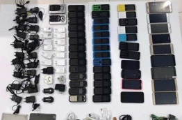 Some of the mobile phones and related electronics that a man attempted to sneak into Maafushi Prison.