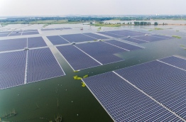 As the United States was withdrawing from the Paris climate pact, China's clean energy ambitions were being reflected in the launch of the world's largest floating solar farm. The 40-megawatt power plant has 160,000 panels resting on a lake that emerged after the collapse of a coal mine in central Anhui province. It is part of Beijing's effort to wean itself off a fossil fuel dependency that has made it the world's top carbon emitter, with two-thirds of its electricity still fuelled by coal. / AFP PHOTO / STR / China OUT / TO GO WITH AFP STORY CHINA-DIPLOMACY-ENERGY-CLIMATE-US,FOCUS BY JULIEN GIRAULT