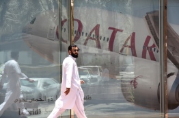 Qatar Airways has made Doha a global hub in just a few years, but barring it from Gulf states' airspace threatens its position as a major transcontinental carrier, experts say. / AFP PHOTO / FAYEZ NURELDINE