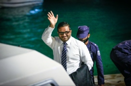 Former VP Ahmed Adheeb escorted to a speedboat on his return to Maafushi Prison after a hearing at the Criminal Court. FILE PHOTO/MIHAARU