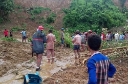 Heavy monsoon rains and landslides have killed at least 134 people in southeast Bangladesh, burying many in their homes as they slept, authorities said. / AFP PHOTO / STR