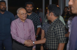 Former President Maumoon shakes hands with Thulusdhoo MP Mohamed Waheed Ibrahim prior to departing for Singapore. PHOTO: HUSSAIN WAHEED/MIHAARU